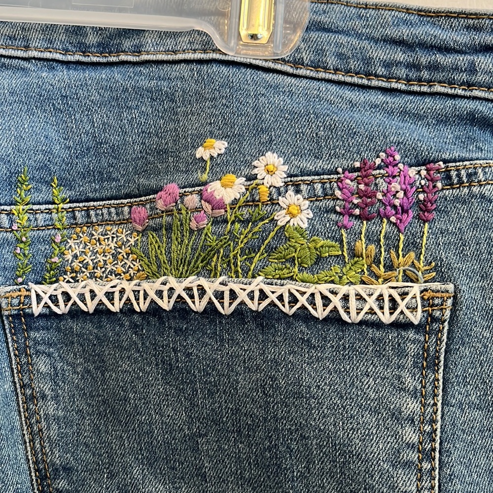Blue jeans with hand embroidery on back pocket